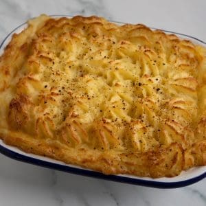 A freshly baked fish pie with golden crust.