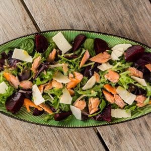Fresh trout salad with mixed greens and vinaigrette dressing.