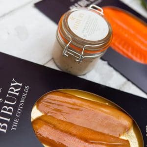 Various packages of trout fillets and jars of pâté.
